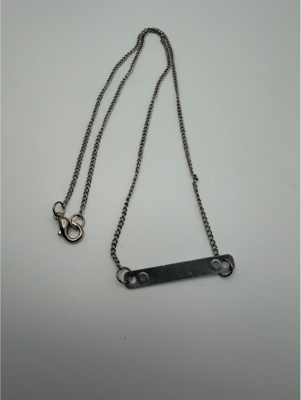 Silver tone bar pendant necklace